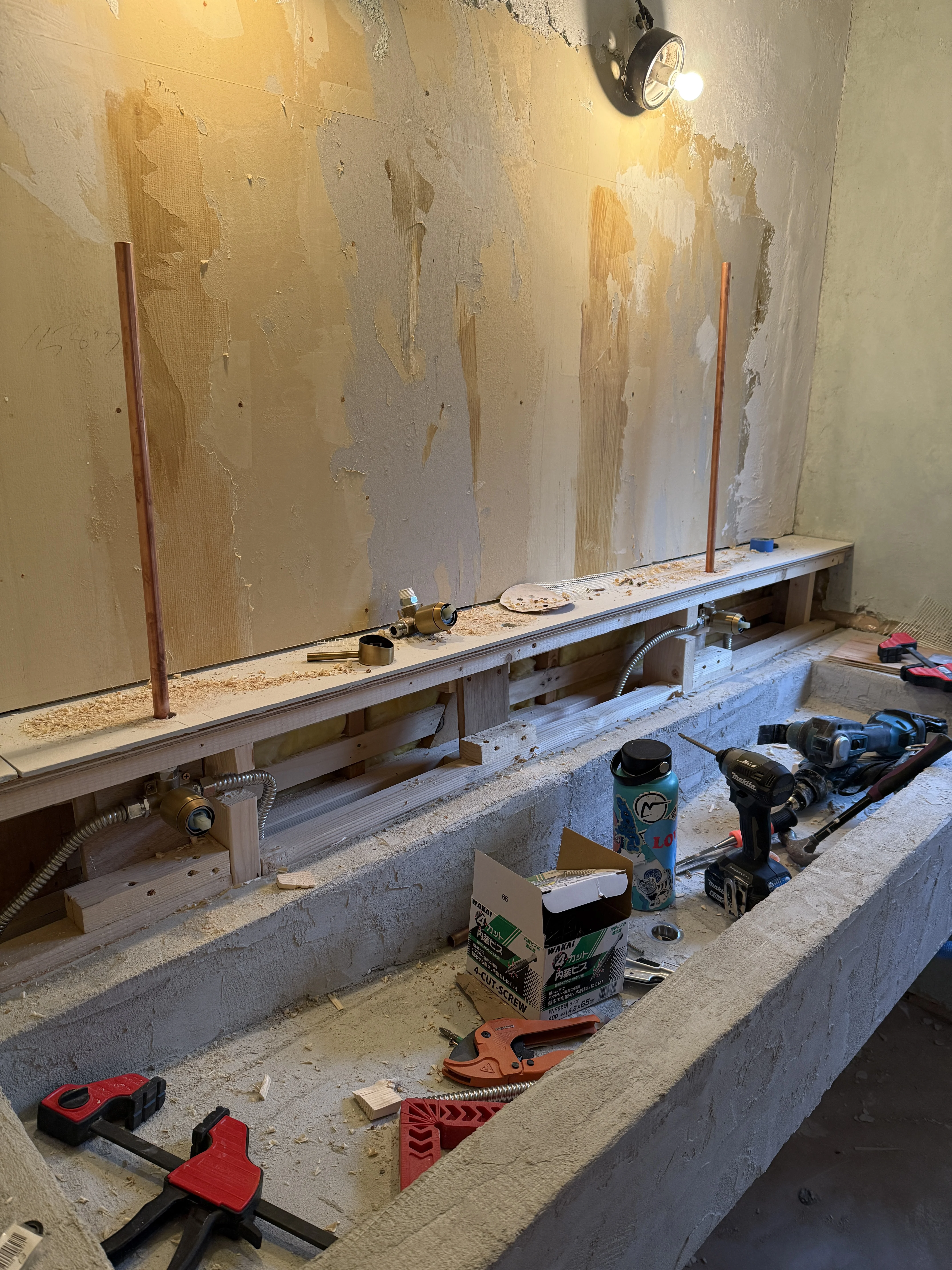 work in progress sink with faucet plumbing underway